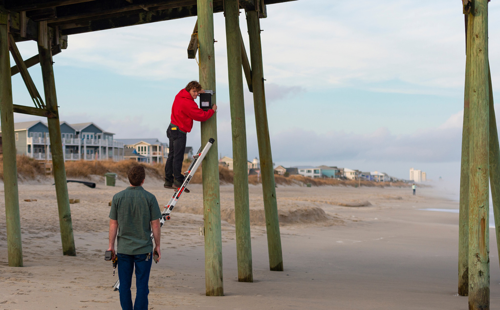 two people work on erosion surveillance
