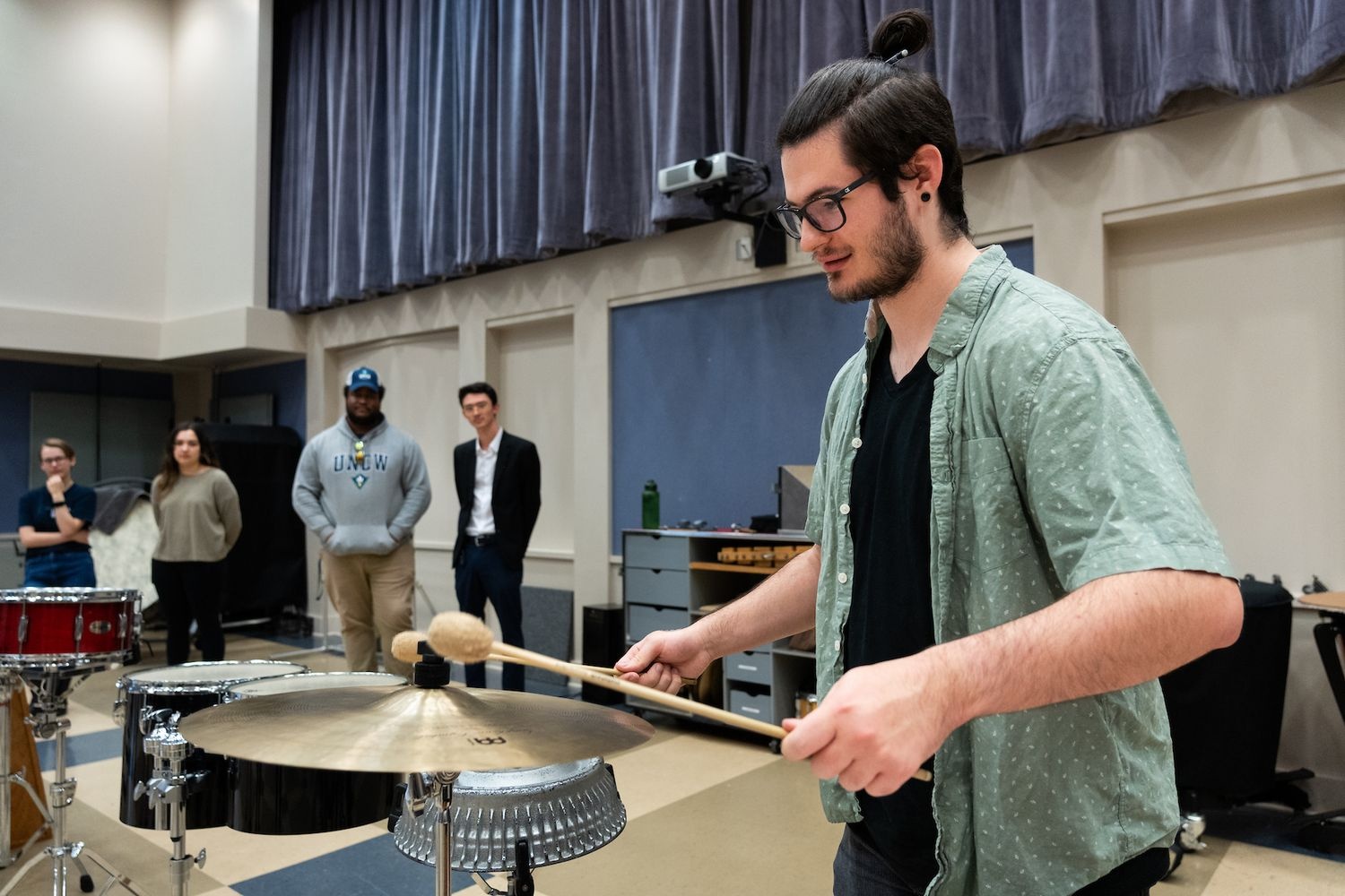 Music Composition class student plays instrument
