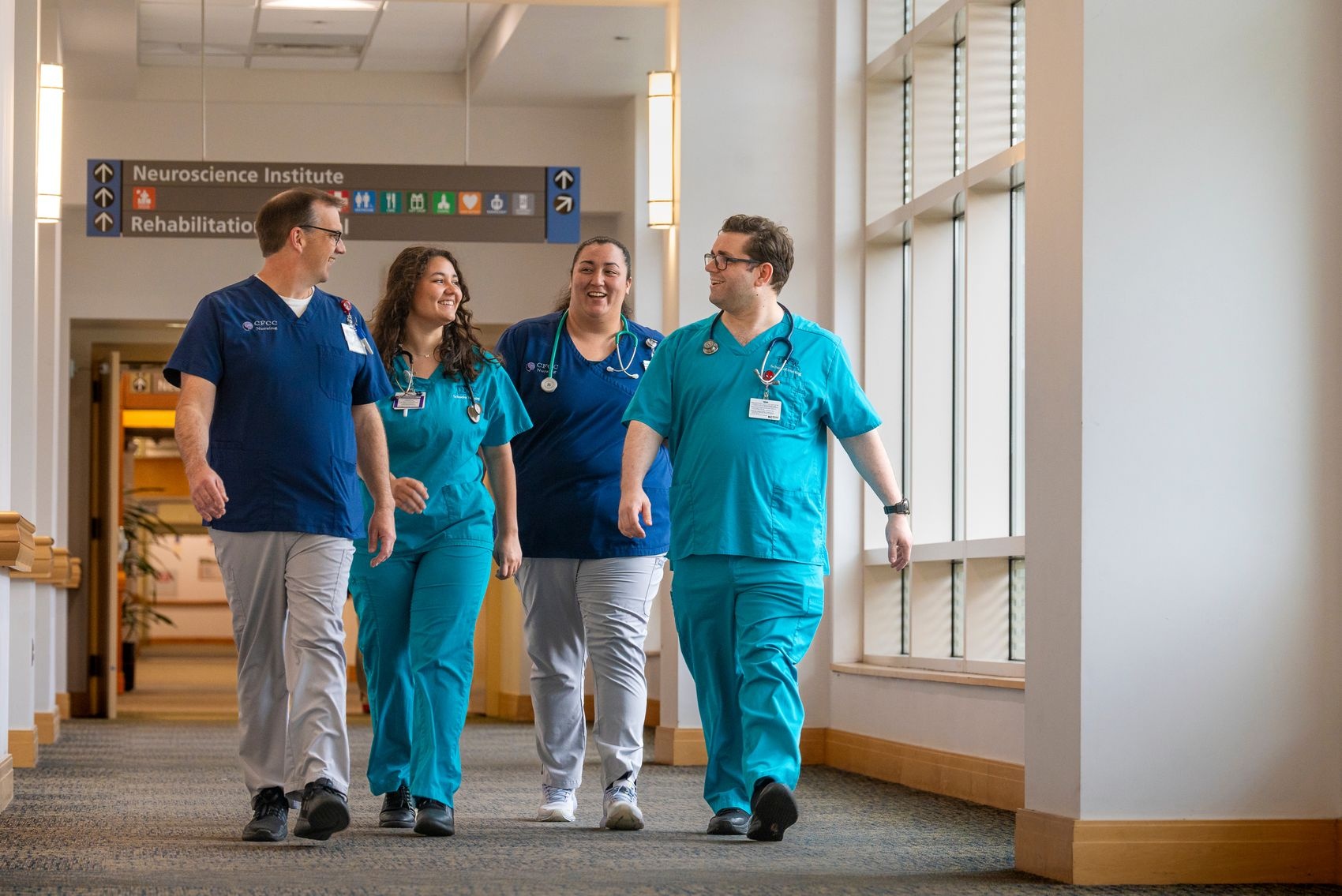 Nursing students from Cape Fear Community College and UNCW walk down the hallway during their clinical shifts at Novant Health New Hanover Regional Medical Center.