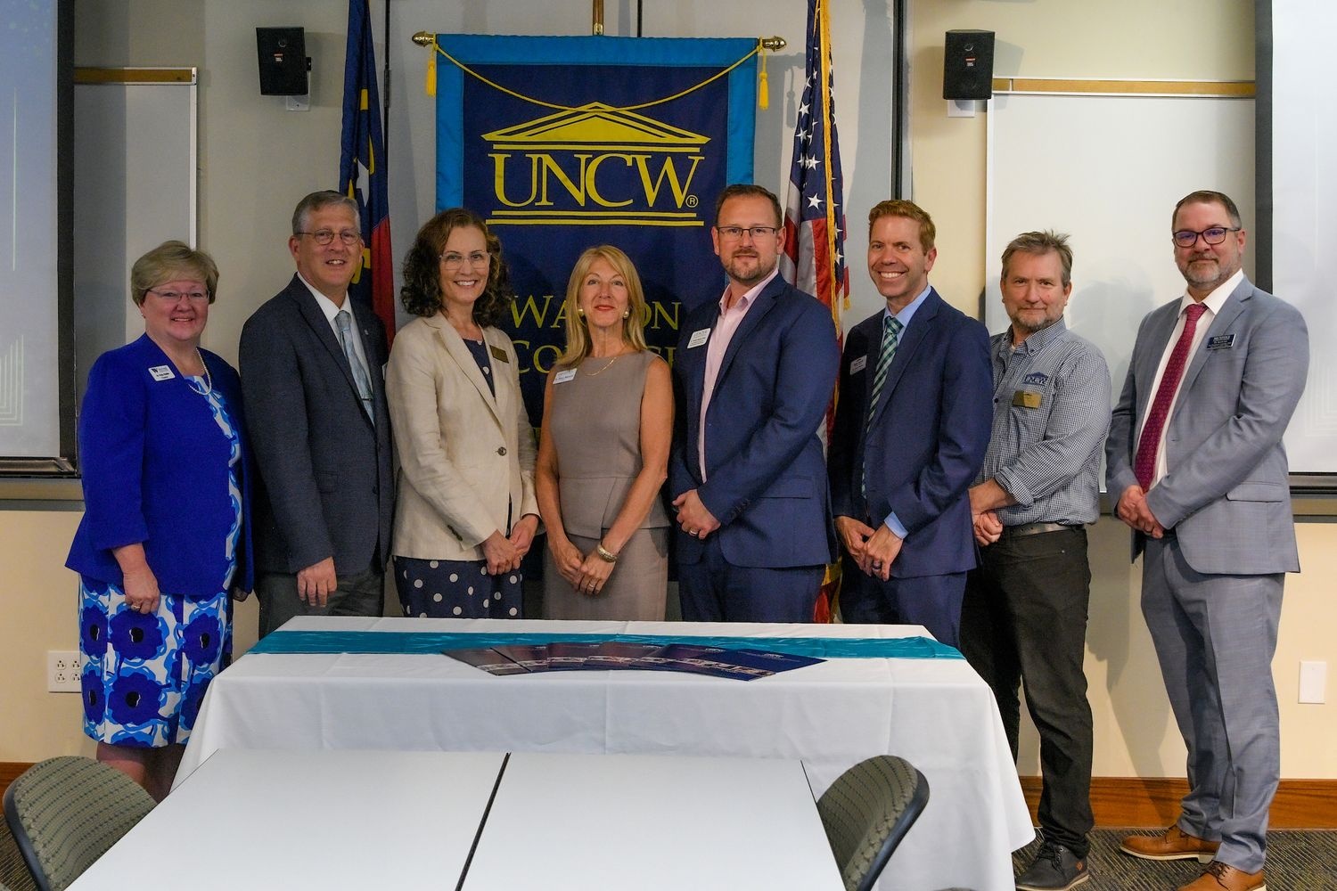 STEP-IN partners at the signing celebration on June 3 (From left: Patty Pfeifer, President, Wayne CC; Raymond Staats, President, Craven CC; Tracy Linderholm, Dean, WCE; Tracy Mancini, President, Carteret CC; Timothy Maddox Fisher, Vice President Academic, Lenoir CC; Dustin Walster, Vice President Academic, James Sprunt CC; Paul Townend, Associate Dean, CHSSA; Kevin Lee, Vice President Academic, Brunswick CC.)