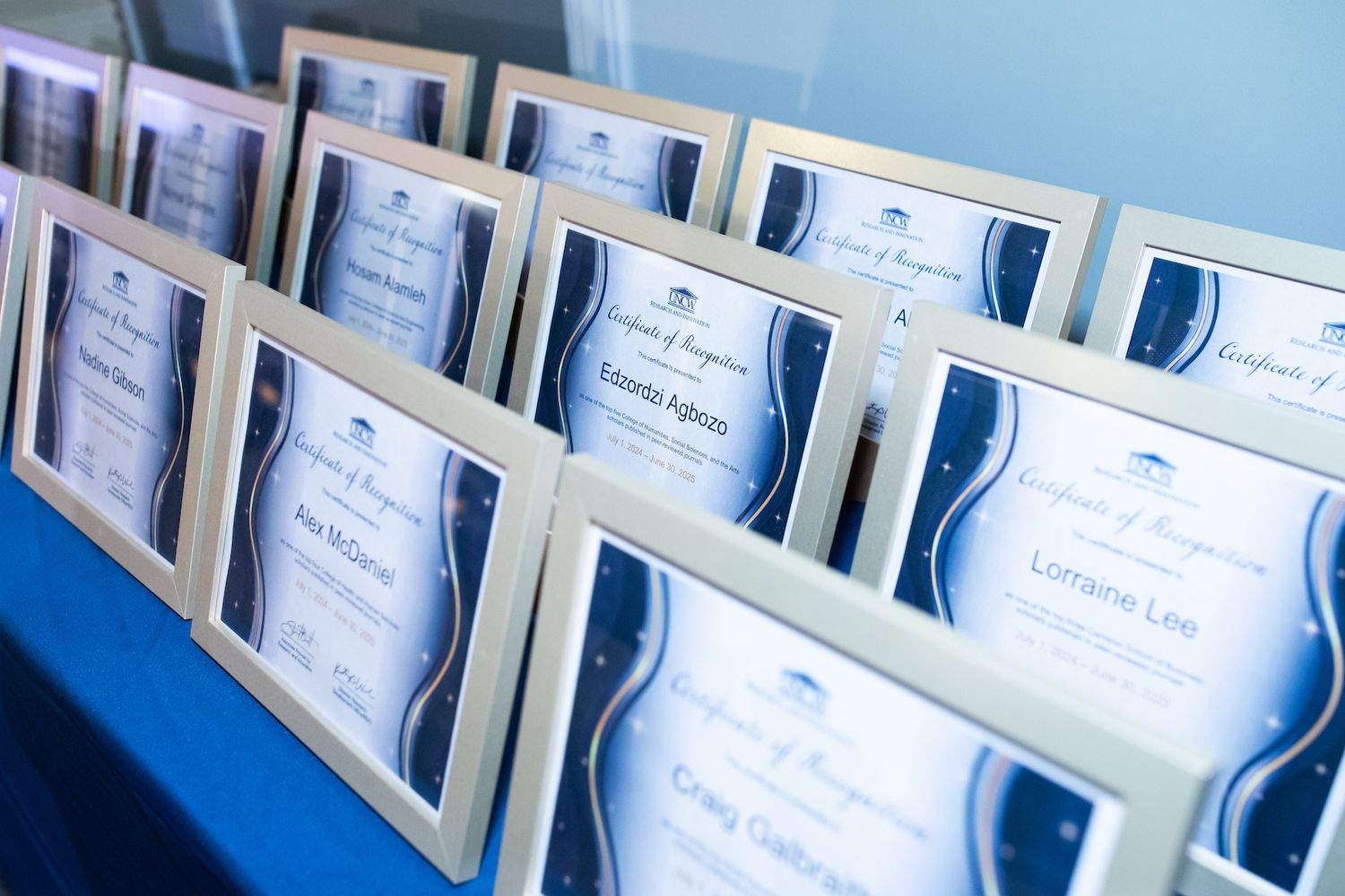 Certificates lined up on stage at annual UNCW research reception.