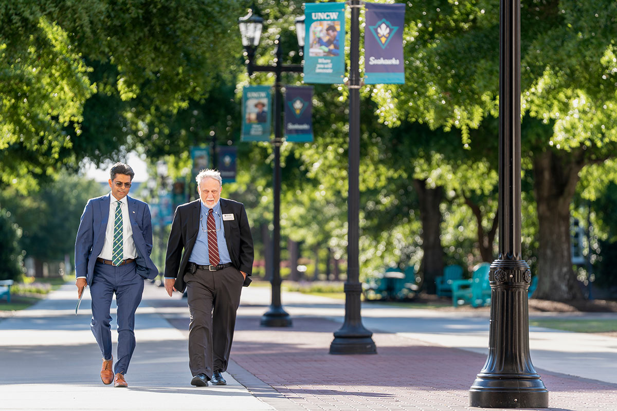 Chancellor Volety strolls Chancellor's Walk with Dan Anderson, special assistant to the president of Elon University