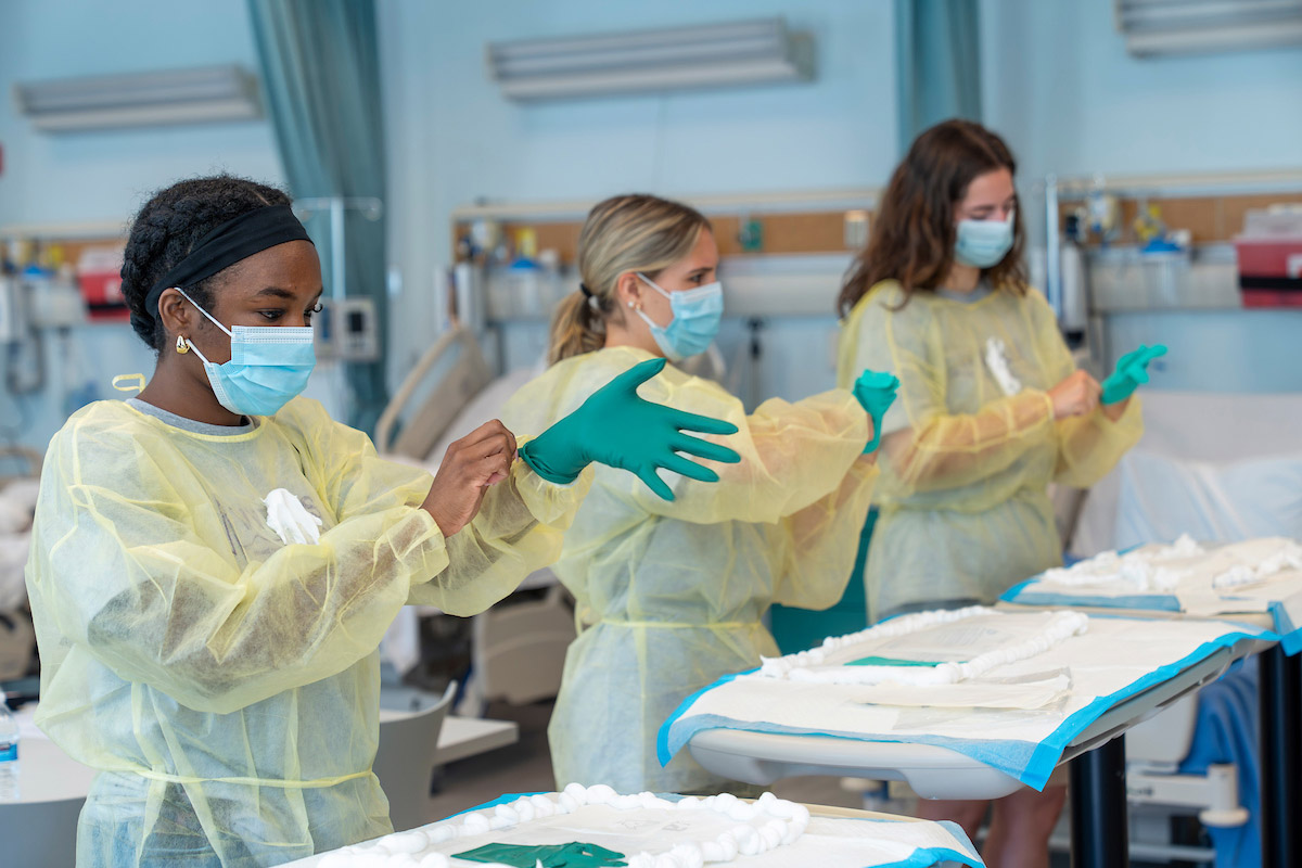 VITALS participants put on personal protective equipment
