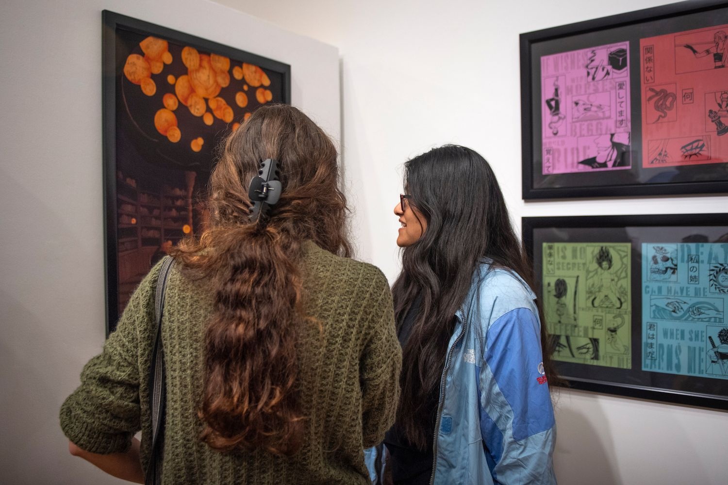 Guests view artwork on display at the UNCW Cultural Arts Building Gallery. 