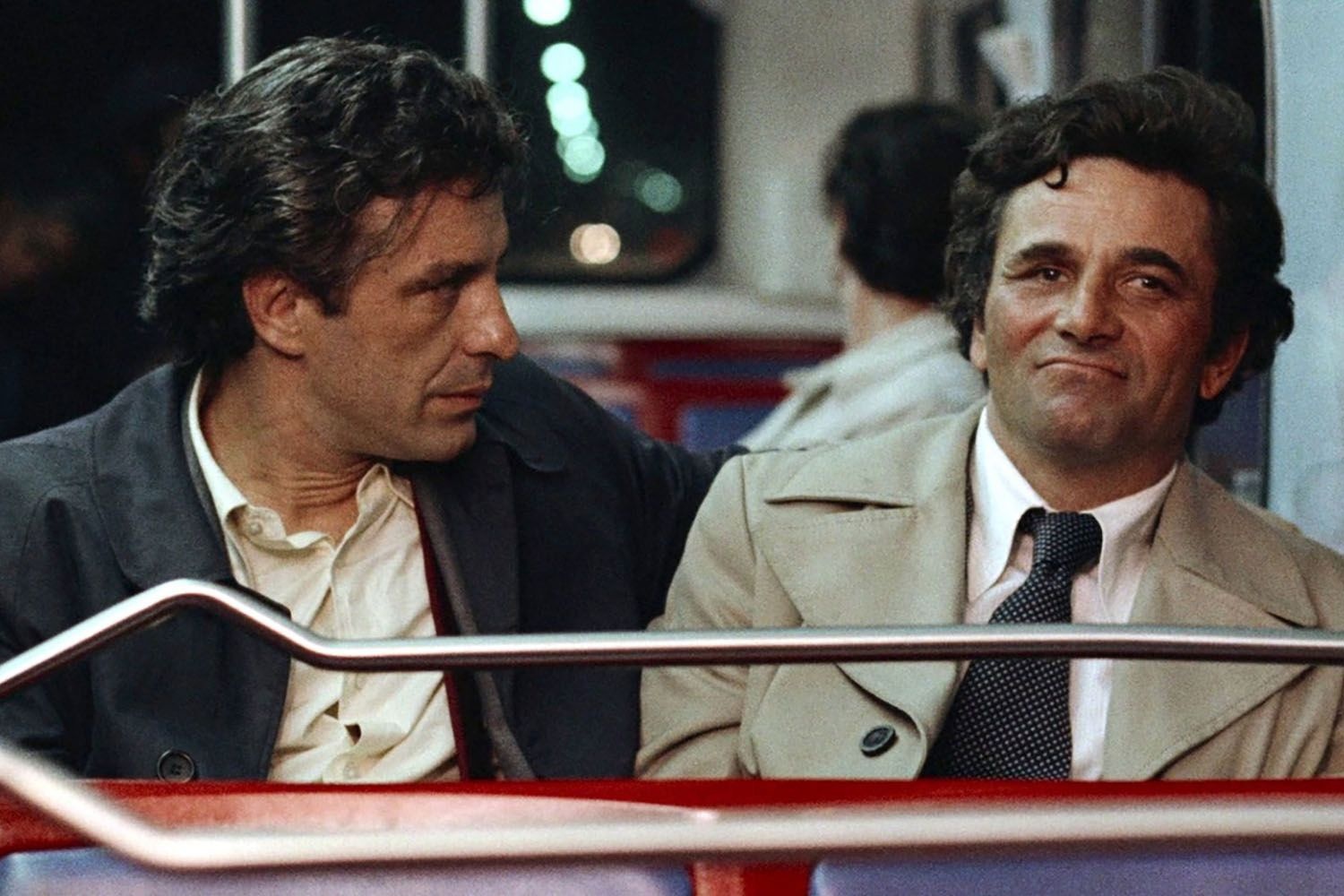 John Cassavetes and Peter Falk sit on a bus in a scene from the film Mikey and Nicky