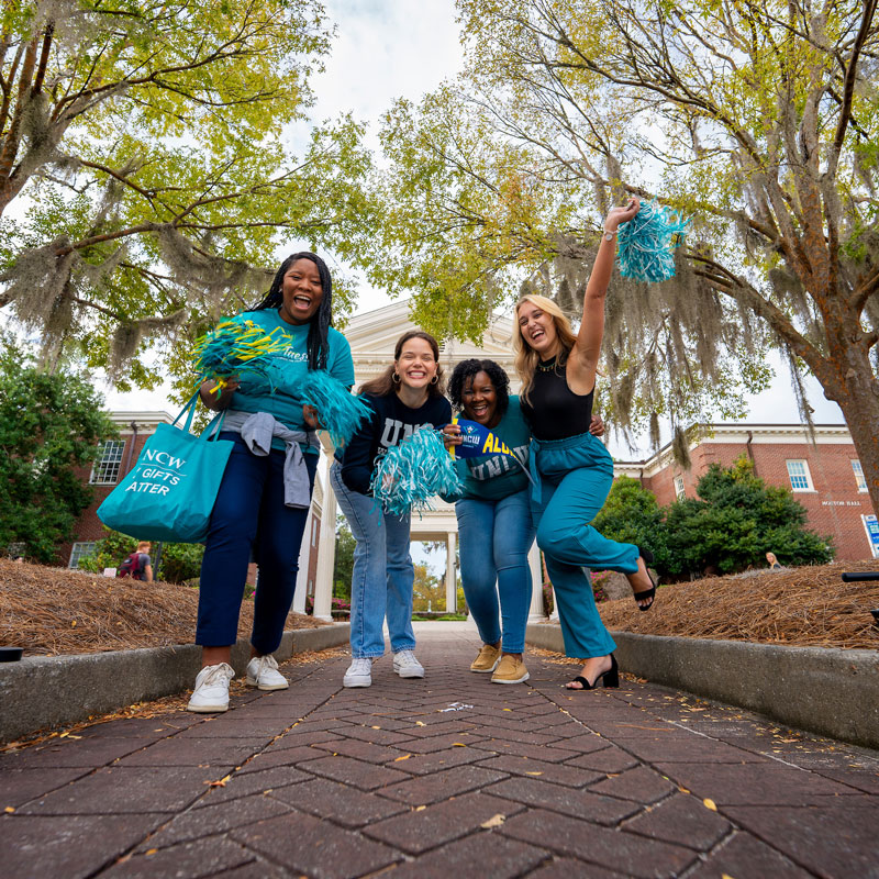 Students celebrating wearing teal