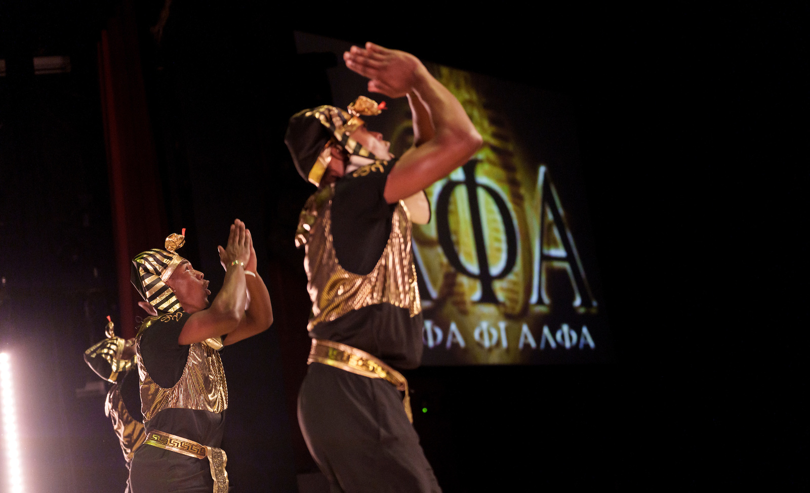 People in costumes performing on stage