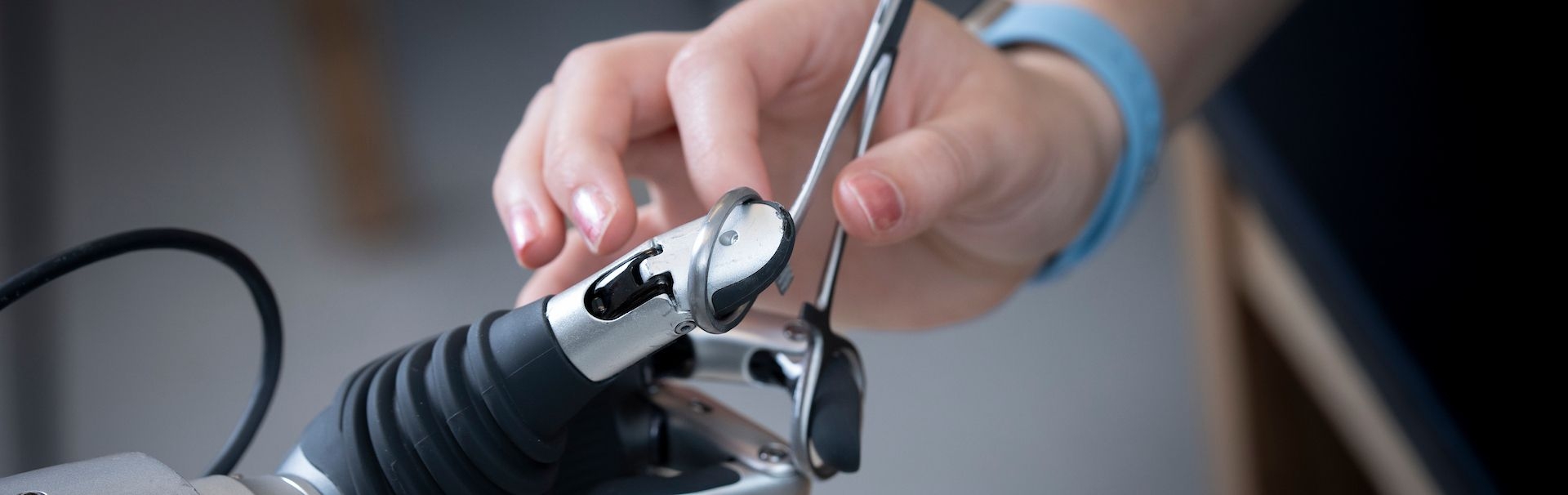 Person interacting with a robotic hand