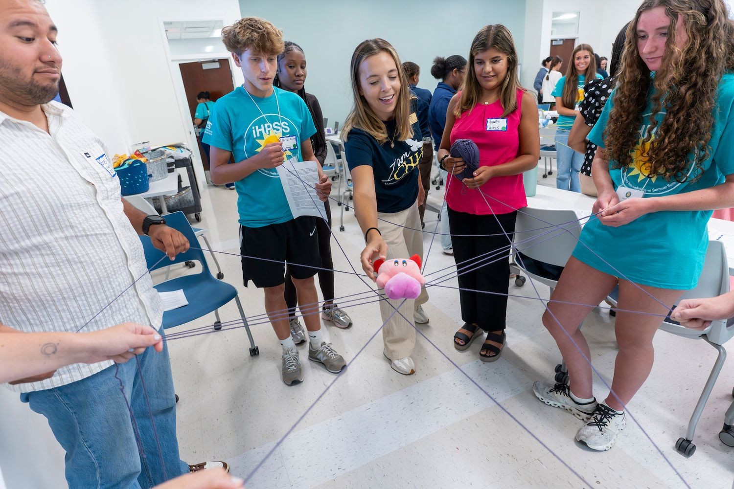 Several iHPSS summer campers participate in a team building exercise.