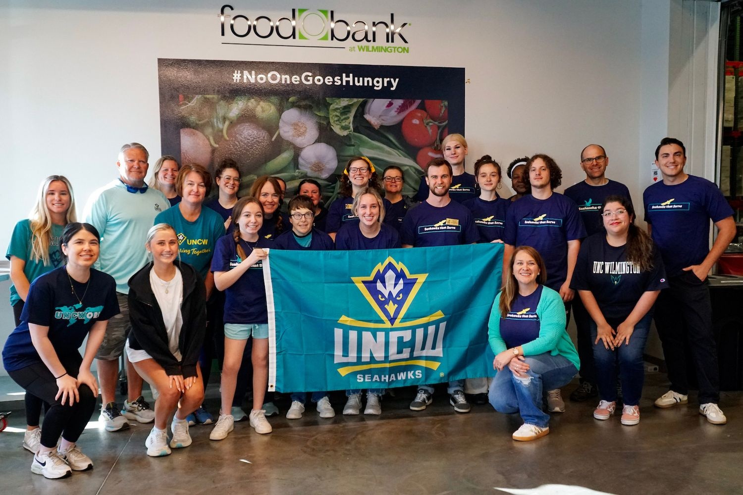 Uncw teal takeover of food bank cenc of wilmington