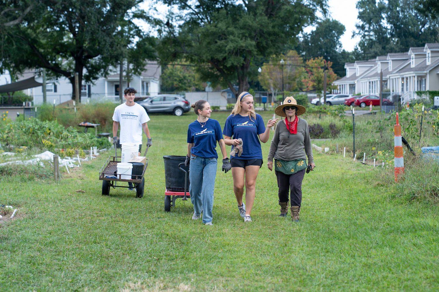 Participants for Seahawks that Serve walking through a field