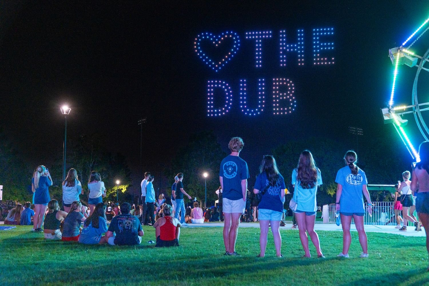 Group of students at the drone show with lights