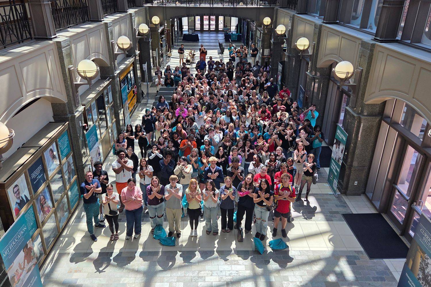Future Teachers Conference attendees giving Wings Up