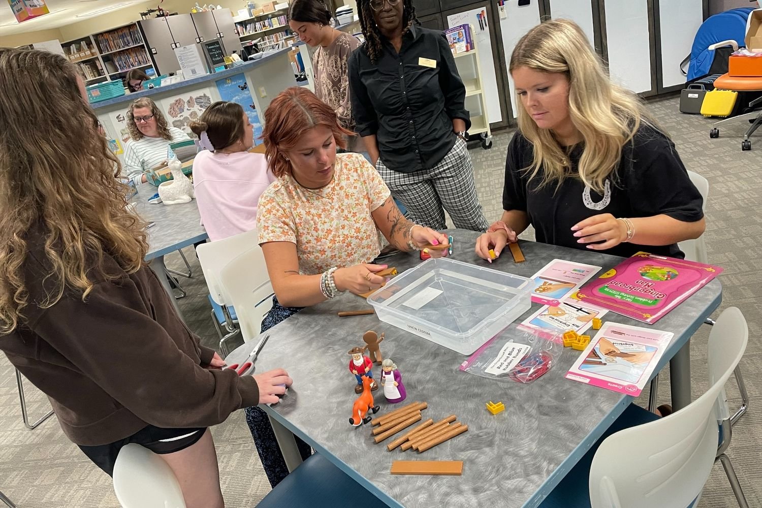 Participants playing with crafts in the CMC