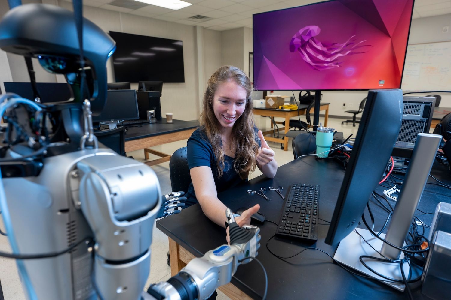 Student interacting with a robot