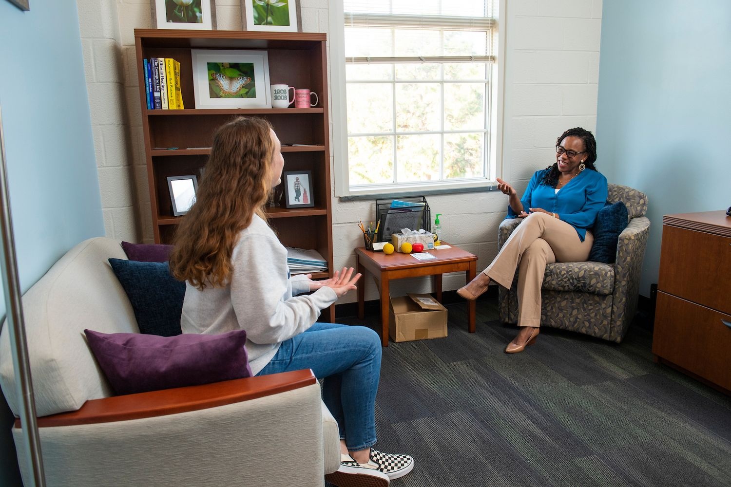 Counselor speaking with a student during a counseling session