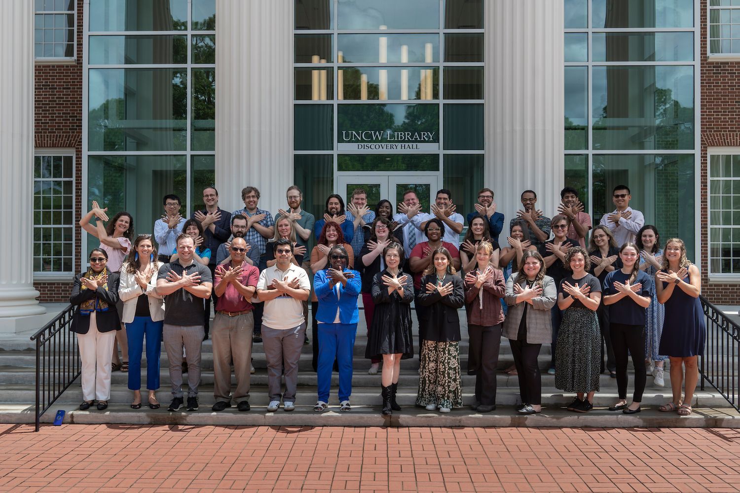 Faculty members posing outside 