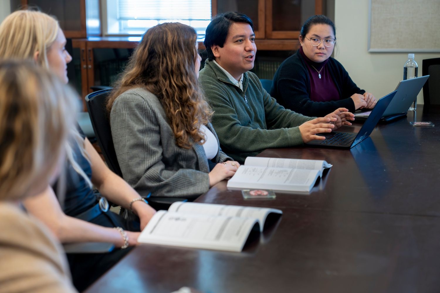 People sitting around a table in a GPAC meeting room