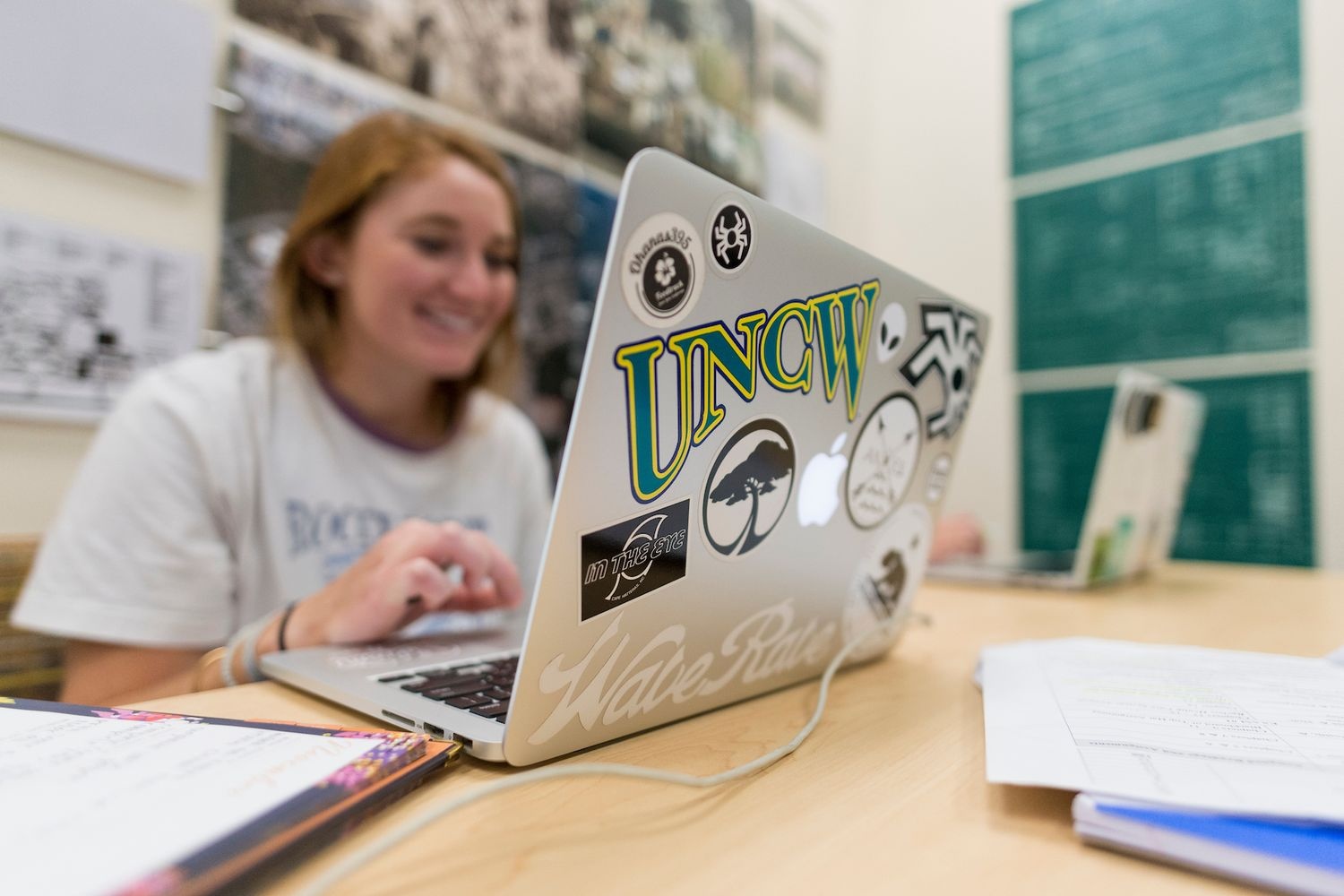 Student typing on their laptop