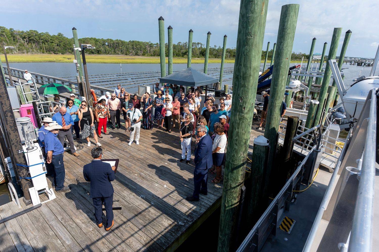 people congregated on the CMS dock to welcome the R/V Osprey
