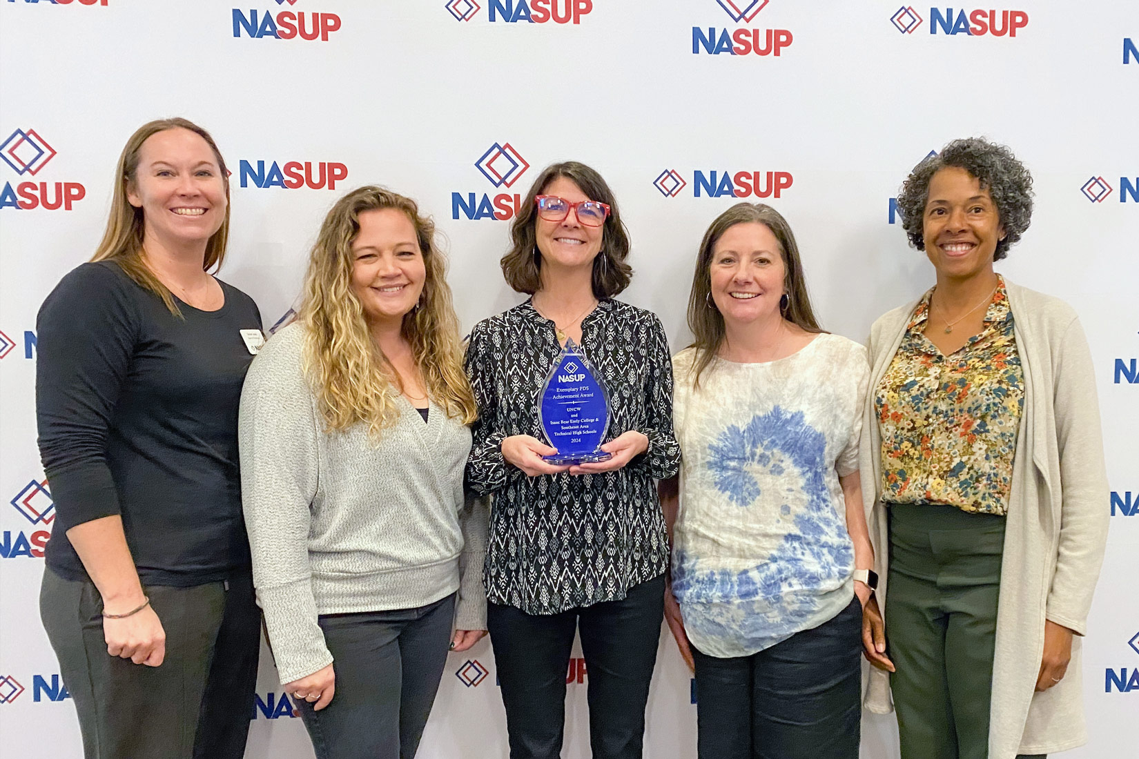 Watson College of Education’s Professional Development System (PDS) School-University Partnership has received the 2024 Exemplary PDS Award from the National Association of School-University Partnerships. Pictured (left to right) are WCE faculty Somer Lewis, Ashley Wall, Danielle Talbert, Christa Thompkins, Candace Thompson.
