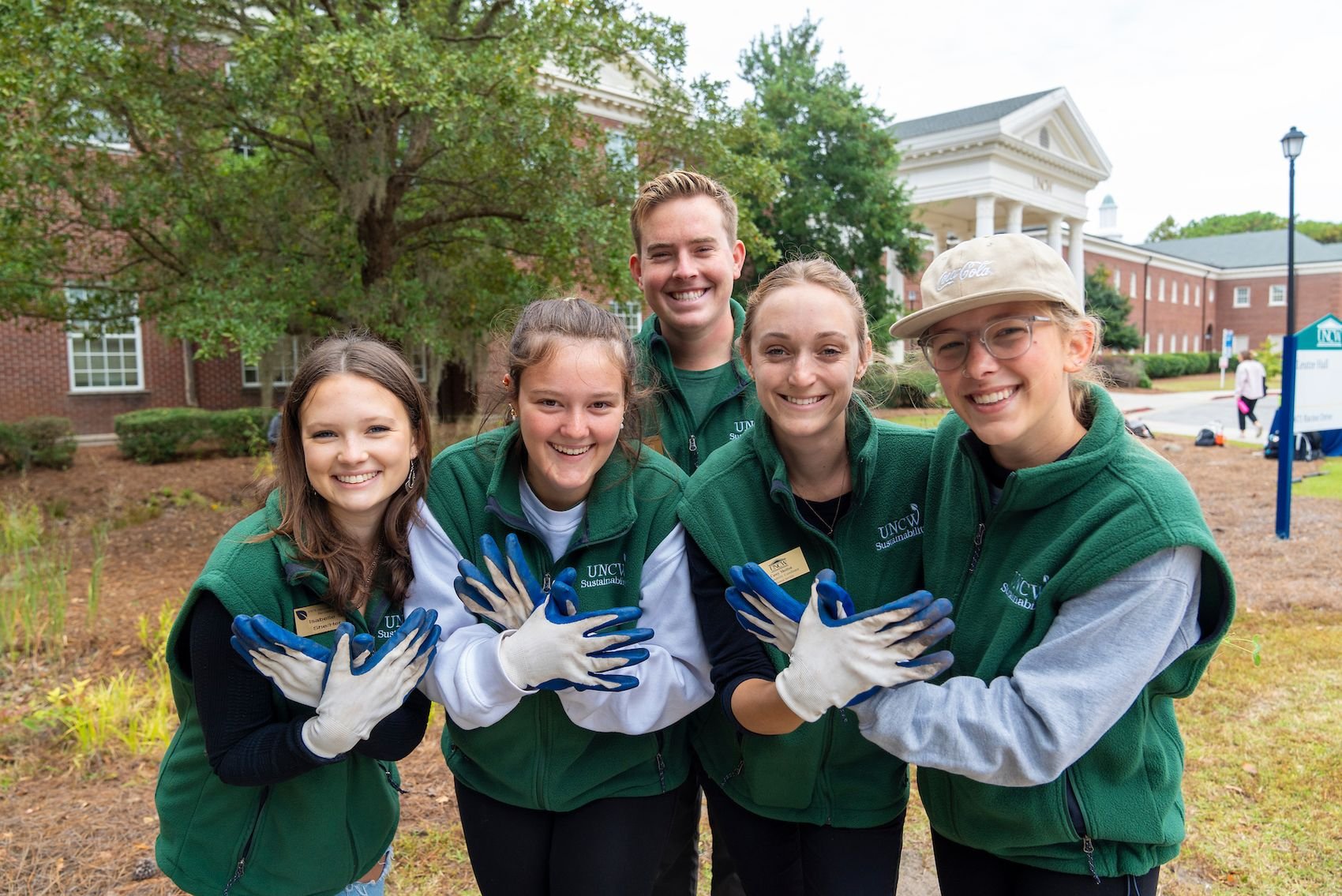 UNCW Sustainability Peer Educators serve as the link between the Office of Sustainability and the campus community by conducting educational programs and events. They are pictured at an event in 2023. 