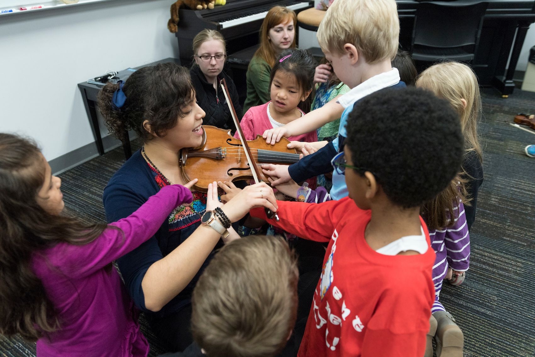 Marscia Martinez-Mendoza is a UNCW student who works with students ages 4-60 to learn to play the violin.