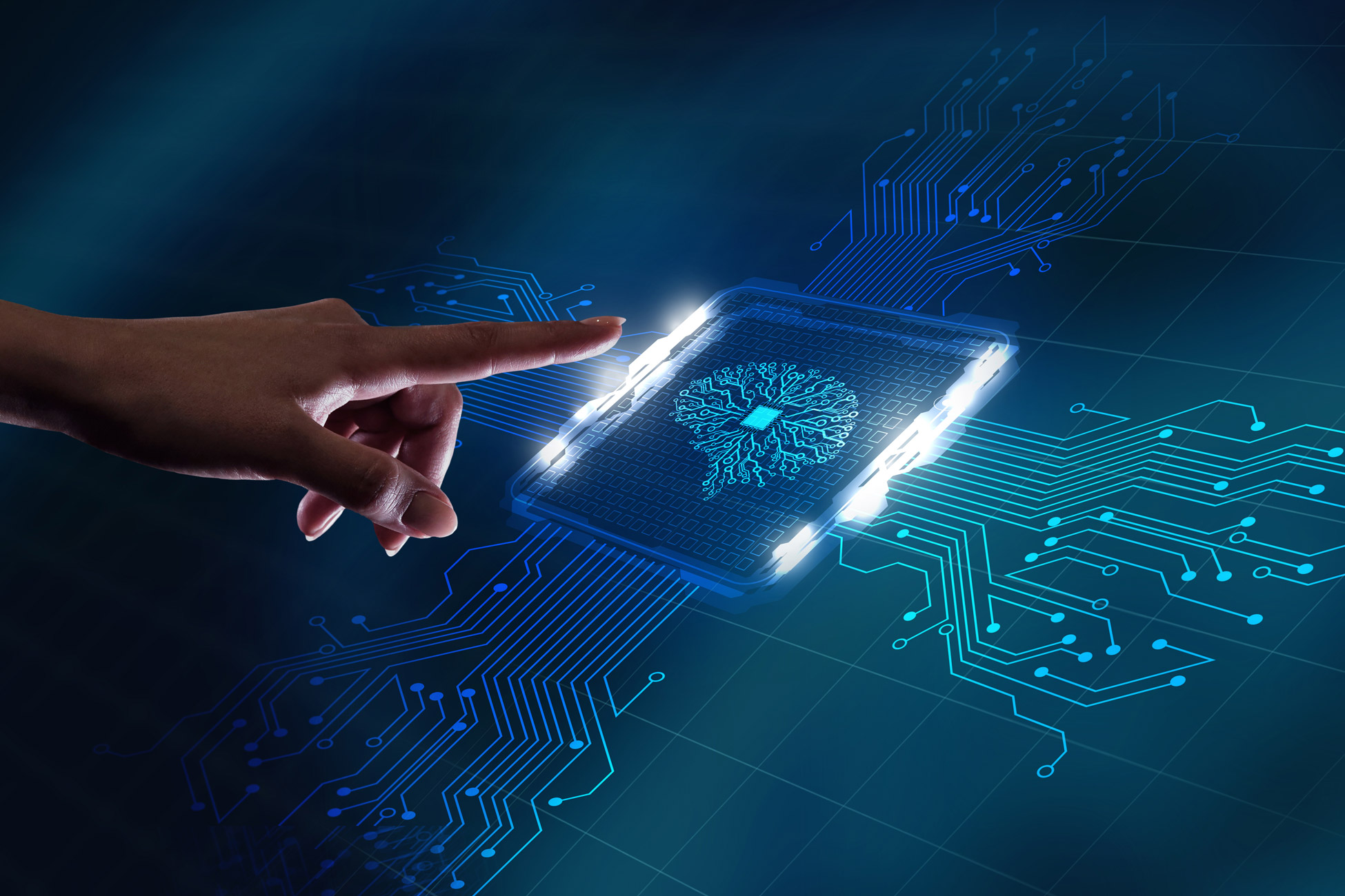 Hand touching a computer chip with an ai symbol in the middle