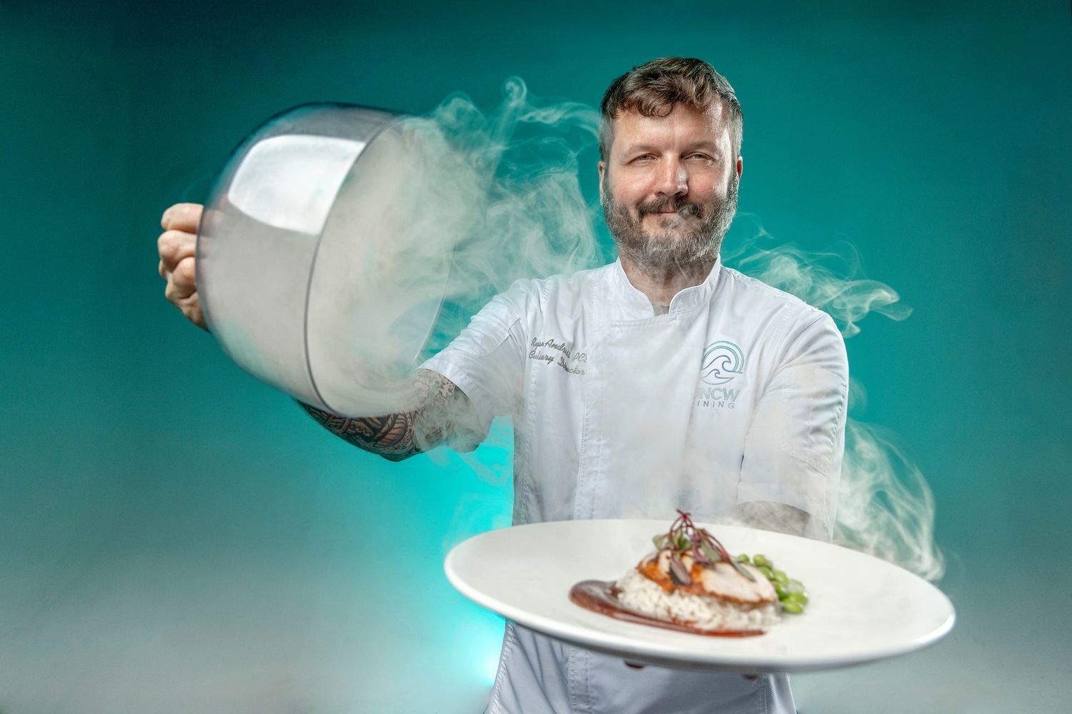 chef holding a platter of food