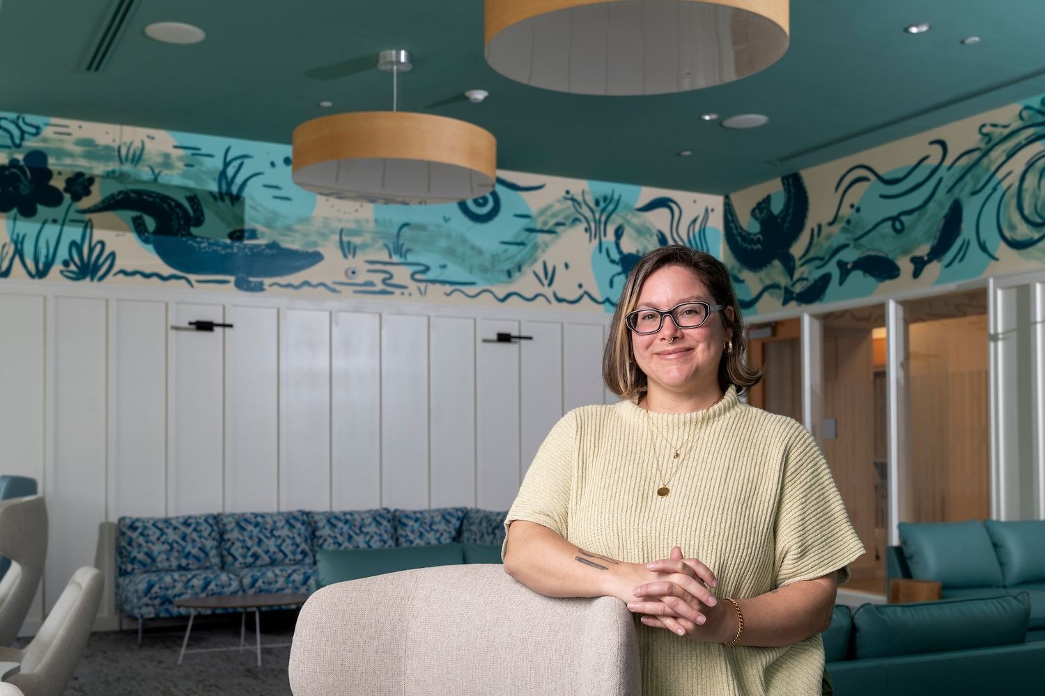 Alumna Carleigh Sion ’12 adds a vibrant touch to UNCW’s Discovery Hall with a mural in The Lookout, blending coastal North Carolina’s natural beauty.